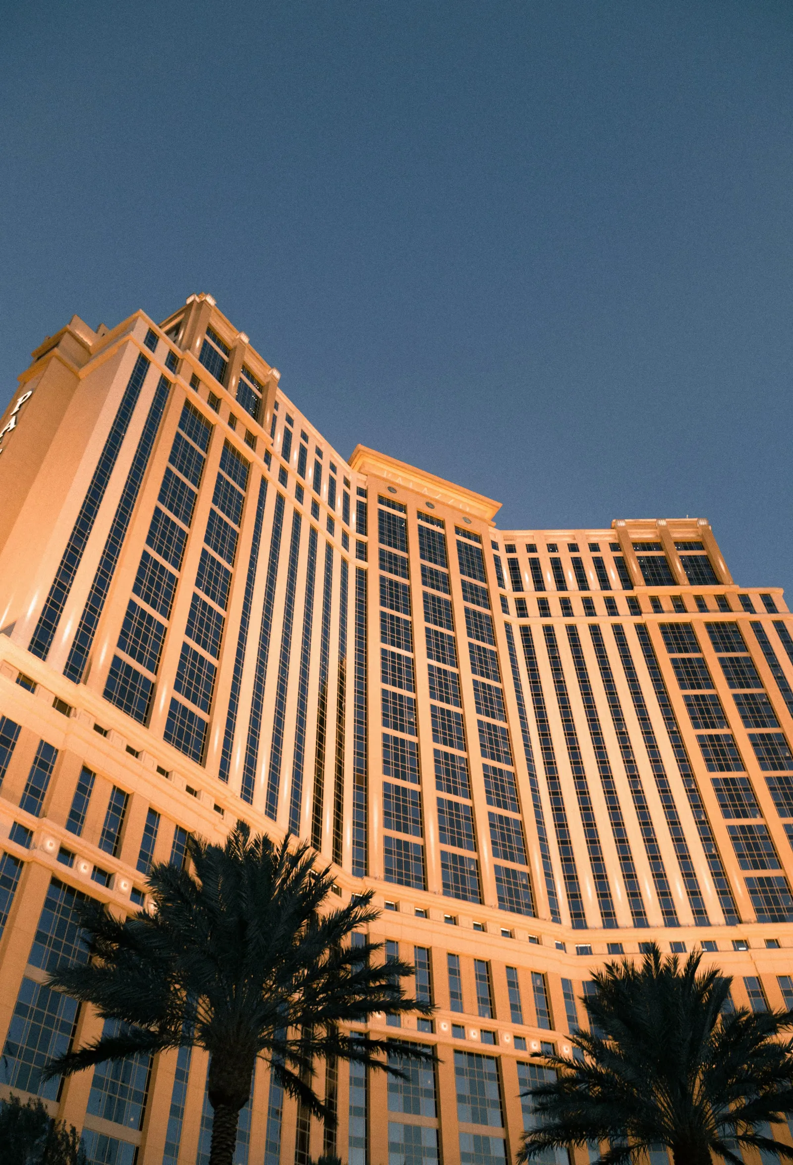 A large hotel tower at dusk